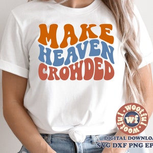 May include: White t-shirt with the text "Make Heaven Crowded" in a retro, colorful font. The text is in orange, blue, and red.