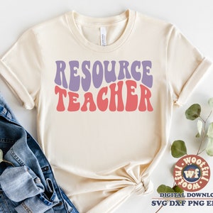 May include: A beige t-shirt with the text "RESOURCE TEACHER" in a retro, wavy font. The text is in shades of purple and pink.