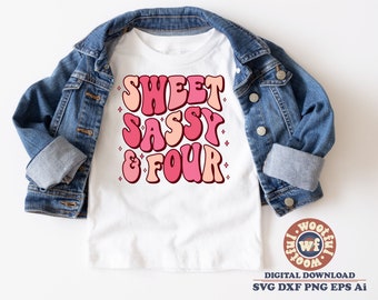 May include: A white t-shirt with the text "Sweet Sassy & Four" in pink and orange retro-style lettering. The shirt is on a denim jacket.