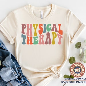 May include: A white t-shirt with the text "PHYSICAL THERAPY" in colorful, retro-style lettering.