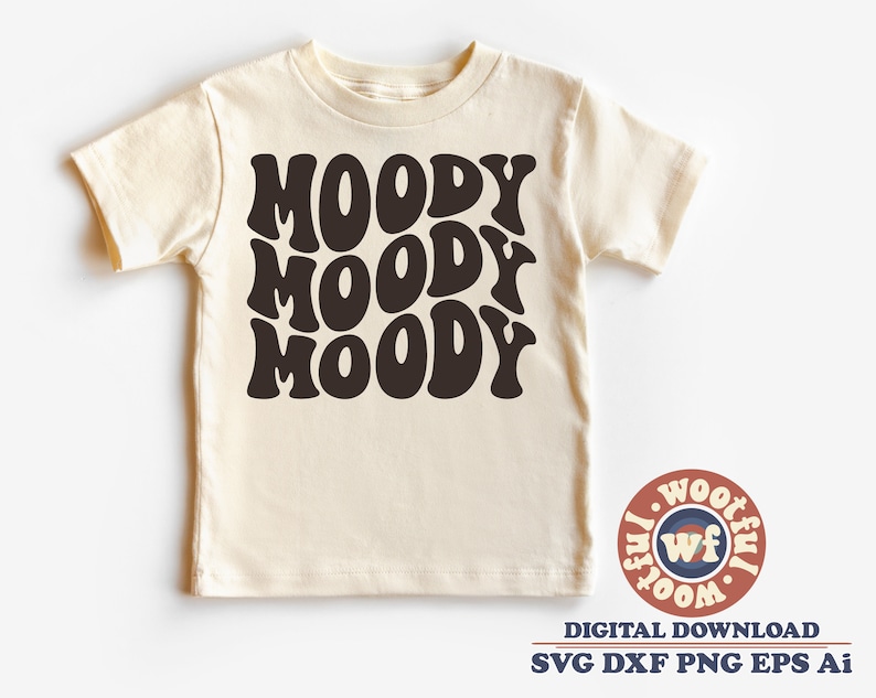 May include: A cream colored t-shirt with the word "MOODY" repeated three times in a retro, black, wavy font.