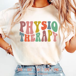 May include: A white t-shirt with the text "PHYSIO THERAPY" in rainbow colored letters. The letters are in a retro, wavy font style.
