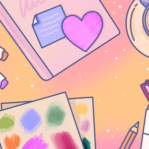 May include: A flat lay of art supplies on a pink and orange background. The supplies include a pink notebook with a heart sticker, a set of colored markers, a set of watercolor paints, a pencil, a white marker, and a notebook with a pink cover.