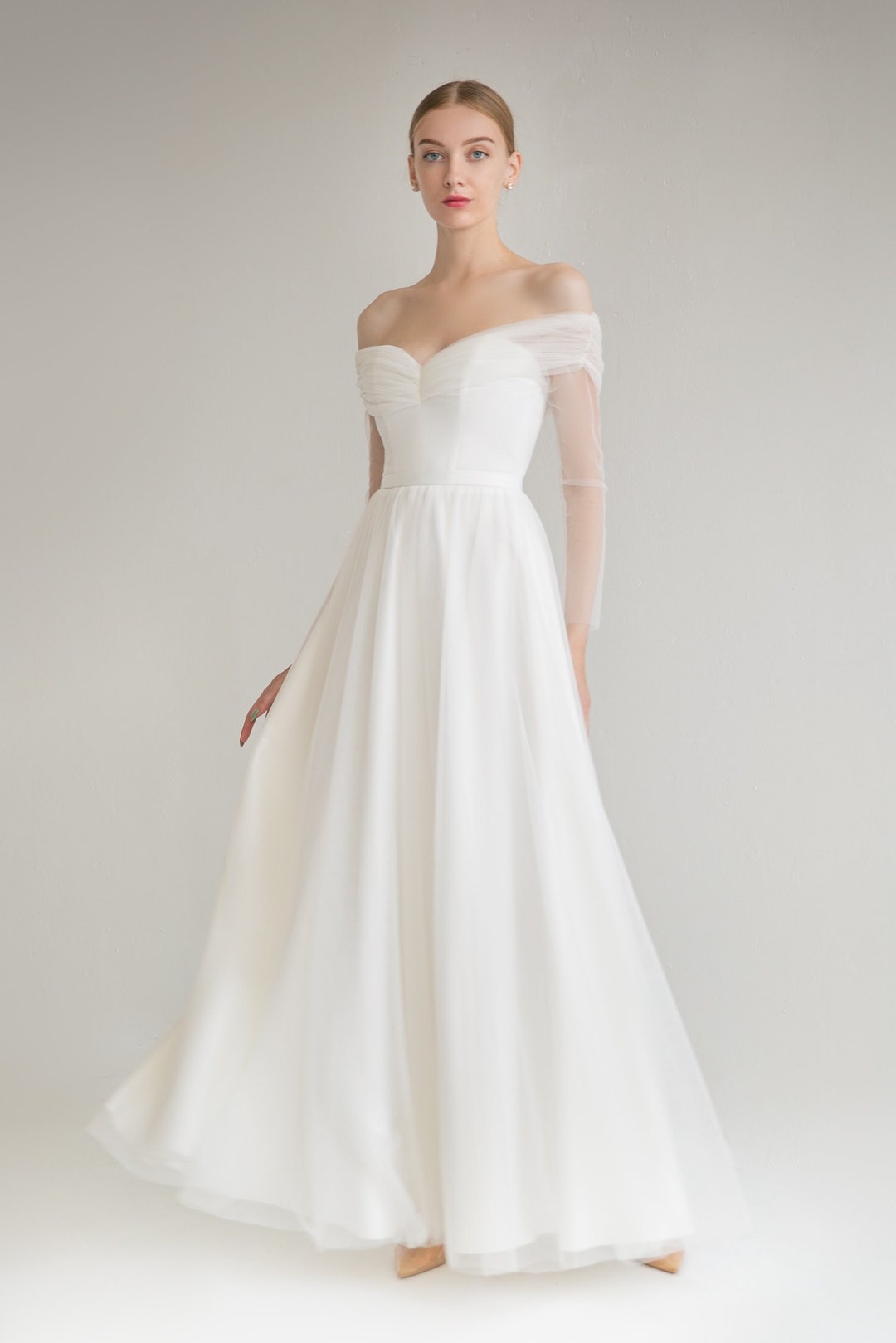 Elegant A-Line Tulle Off-Shoulder Wedding Gown with Open Back Design main image 1