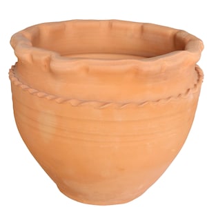 May include: A terracotta-coloured, handmade, unglazed clay pot. The pot has a wide, ruffled rim and a decorative, wavy band around the middle. The pot's body tapers to a rounded base, suitable for plants or decorative use.