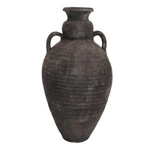 May include: A large, dark grey ceramic vase with two handles. The vase has a textured, rustic look.