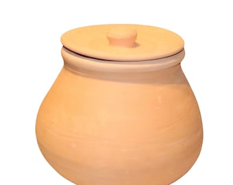 May include: A terracotta-colored ceramic jar with a matching lid. The jar has a rounded body and a slightly flared rim. The lid has a small knob for easy removal. The jar is likely used for storage or decorative purposes.