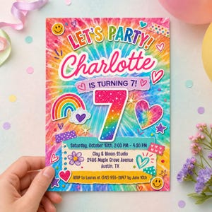 May include: A rectangular birthday invitation card with a vibrant tie-dye background featuring the text LET'S PARTY! Charlotte IS TURNING 7! The card includes a large glittery number 7, a rainbow, hearts, stars, and smiley faces, with event details for October 10th at Clay & Bloom Studio in Austin, TX.