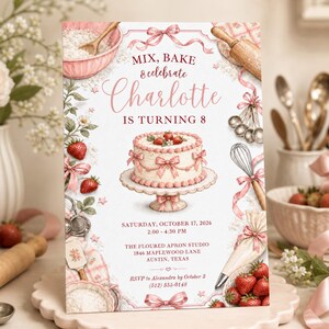 May include: A rectangular birthday invitation card featuring a white background with pink strawberry and baking illustrations. Text reads: Mix, Bake & celebrate Charlotte IS TURNING 8, Saturday, October 17, 2026, 2:00 - 4:30 PM, The Floured Apron Studio, 1846 Maplewood Lane, Austin, Texas, RSVP to Alexandra by October 3 (512) 555-0148.