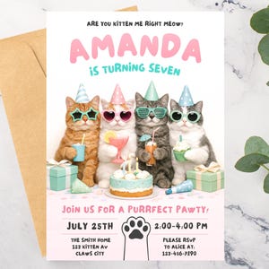 May include: A colourful birthday invitation with the text "Amanda is turning seven". The invitation features four cats wearing party hats and sunglasses, with a cake and presents. The invitation includes the date, time, and location of the party, with a paw print.