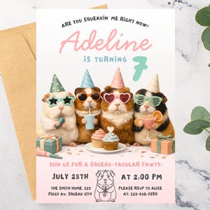 May include: A birthday party invitation featuring four guinea pigs wearing party hats and sunglasses. The invitation reads "Adeline is turning 7" and includes party details. A brown envelope is on the left.