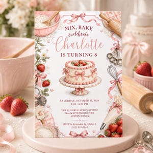 May include: A rectangular birthday invitation card featuring a central illustration of a pink frosted cake on a stand, surrounded by baking tools, strawberries, and ribbons. The text reads: MIX, BAKE & celebrate Charlotte IS TURNING 8, SATURDAY, OCTOBER 17, 2026, 2:00 - 4:30 PM, THE FLOURED APRON STUDIO, 1846 MAPLEWOOD LANE, AUSTIN, TEXAS, RSVP to Alexandra by October 3 (512) 555-0148.