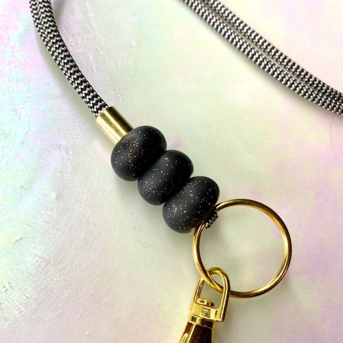 Schwarzes funkelndes Perlenlehrer Schlüsselband/Lanyard