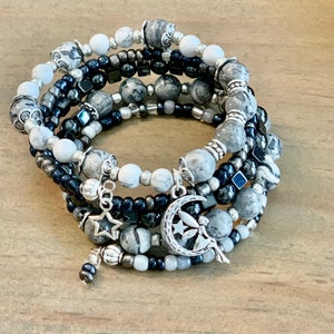 Reach for the stars in these gray map jasper, hematite & howlite set of 2 bracelets