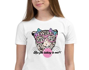 May include: White t-shirt featuring a leopard graphic wearing pink glasses and blowing a bubble. The leopard has a butterfly crown. Text on the shirt reads "Are you talking to me?!"