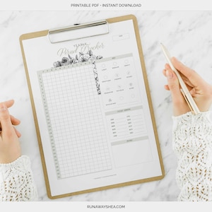 May include: A printable yearly period tracker with a floral design. The tracker includes a grid for tracking your cycle, a section for noting symptoms, and a section for recording cycle length.