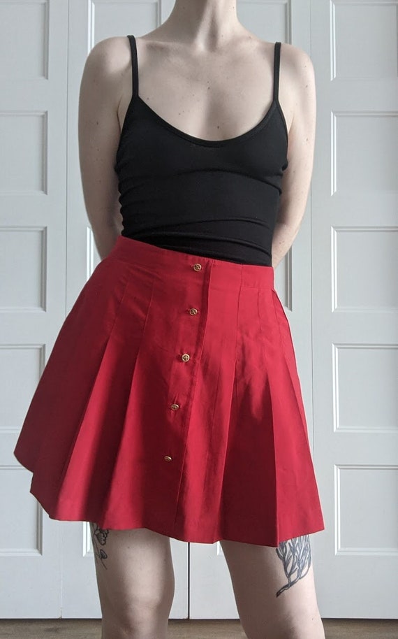 Flamboyant pleated skirt.