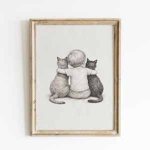 May include: A framed pencil sketch depicts a child seated between two cats, their arms wrapped around the animals. The artwork is in grayscale, with the child wearing a white shirt and jeans. The frame is a light brown color.