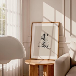May include: A framed print featuring a heartwarming illustration of a child embracing a dog. The artwork is rendered in a soft, neutral palette, with the child and dog depicted in a tender embrace. The frame is a warm brown, adding to the cozy aesthetic.