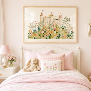 May include: A framed horizontal wall art print featuring a detailed illustration of a stone castle surrounded by a vibrant garden with colorful flowers, green foliage, and butterflies, displayed above a bed with pink bedding and a plush rabbit toy.