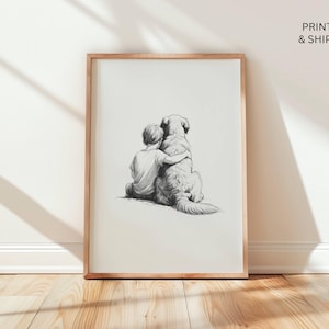 May include: A framed black and white pencil sketch print. The artwork depicts a child hugging a large dog. The print is in a wooden frame and is displayed against a white wall. The text "PRINTED & SHIPPED" is in the upper right corner.