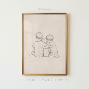 May include: Framed pencil sketch art print featuring three children embracing. The artwork is in a gold frame and has the text "La Mana Luna" at the top and "PRINTED AND SHIPPED" at the bottom.