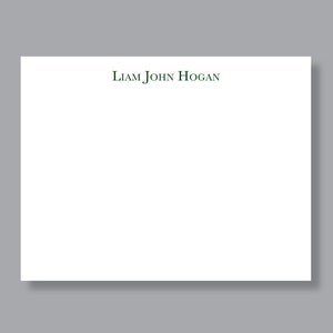 May include: A white stationery card with the name "Liam John Hogan" printed in dark green ink at the top.