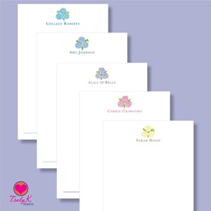 May include: Five white stationery note cards with different colored hydrangea flower illustrations and names printed at the top. The names are Colleen Roberts, Amy Johnson, Alice O'Brien, Carrie Crawford, and Sarah Dowd.