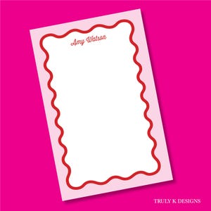 May include: A rectangular notepad with a light pink border and a white center featuring a red wavy line frame. The name Amy Watson is printed in red script at the top. The text Truly K Designs is visible in the bottom right corner of the image.