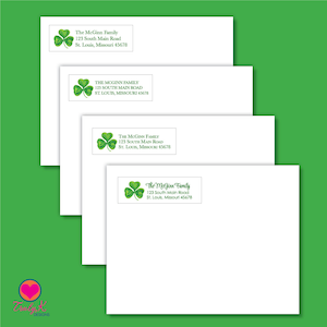 May include: White envelopes with a green shamrock and the text "The McGinn Family, 123 South Main Road, St. Louis, Missouri 45678". The envelopes are stacked on a green background. The Truly K Designs logo is in the bottom left corner.