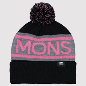 May include: Black knitted beanie with a pink pom pom and a grey and pink stripe with the word "MONS" in pink letters. The beanie has a small black label with the text "MONS ROYALE" on the lower front.
