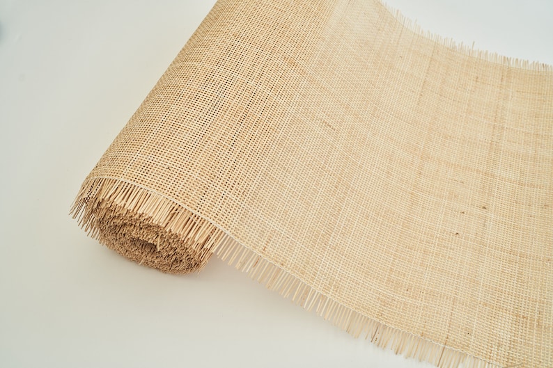 May include: A roll of natural hessian mesh fabric with a fringed edge. The mesh is woven with a fine, even pattern.