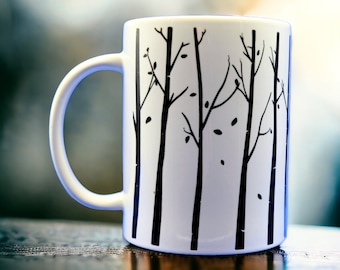 Nature's Beauty: 15 oz White Mug with a Pattern of Black Birch Trees, perfect for Outdoor Enthusiasts.