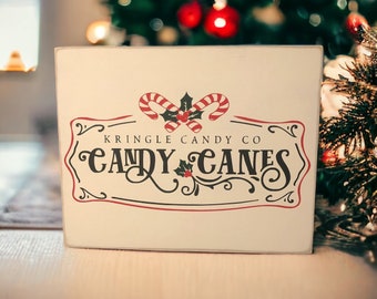 Holiday Charm: 8" x 10" Wood Canvas Sign with Candy Canes Vinyl Lettering on Ivory Paint.