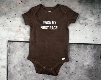 Adorable 100% Cotton Black Onesie with Humorous 'I Won My First Race' Saying for Babies (3-6 Months)