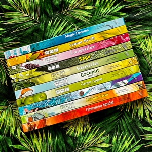 May include: A stack of ten incense sticks with different scents, including Magic Dreams, Lemon Myrrh, Lavender, Sage, Vanilla, Coconut, Green Apple, Sea Breeze, Limpia Casa, and Cinnamon Sandal. Each stick is hand-crafted and made in India.