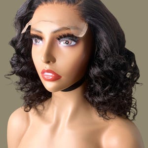 Glueless Wig System Transparent Lace Closure Deep Wave Pattern Virgin Hair Quality Medium Size Construction Pre Plucked Hairline Design Bleached Knots Feature Natural Looking Appearance Black Women Extension Protective Style Option Ready To