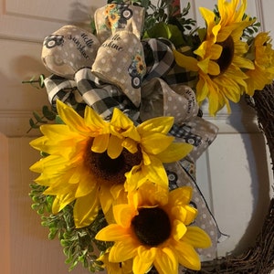 Gorgeous sunflower grapevine wreath with old truck and buffalo check ribbon