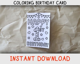 May include: A black and white printable coloring card with the text "Happy 1st Birthday" and a large number one with polka dots. The card has a banner of flags and hearts and stars around the number one.