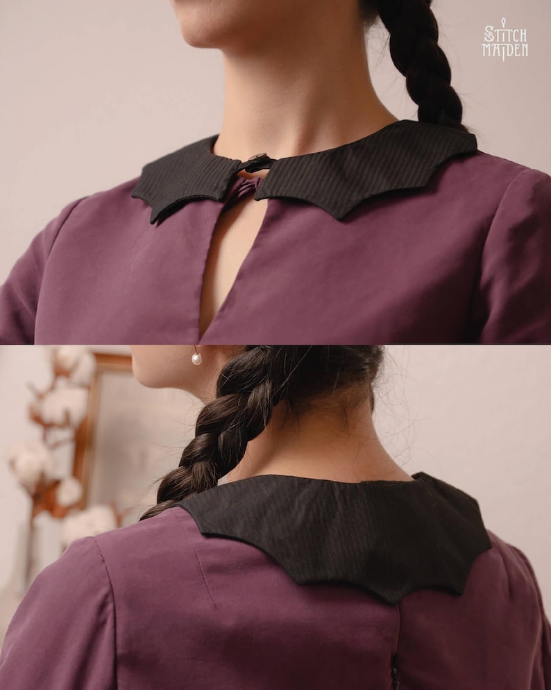 May include: A purple blouse featuring a distinctive black collar with a unique shape and a small clasp fastening. The blouse is made of a soft material. The image is well-lit, highlighting the collar and blouse details. The Stitch Maiden logo is visible in the top right corner.