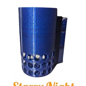 May include: A blue 3D printed cup holder with a Starry Night design. The cup holder has a circular pattern of holes around the bottom.