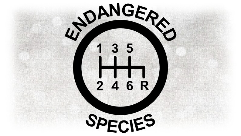 May include: Black and white graphic of a gear shift with the numbers 1, 2, 3, 4, 5, 6, and R. The words "ENDANGERED" and "SPECIES" are written above and below the gear shift.