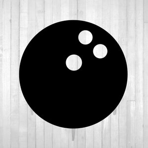May include: A black bowling ball with three white pins on a white wood background.