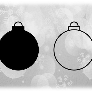 May include: Two Christmas ornaments, one black and one white, with a simple design. Both ornaments have a small loop at the top.
