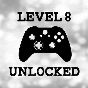 May include: Black and white graphic design with a video game controller and the text "LEVEL 8 UNLOCKED".