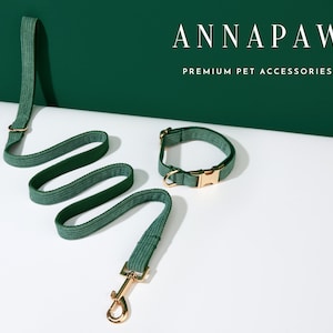 May include: A green corduroy dog leash and collar set with gold hardware. The leash is coiled and the collar is laying flat. The text "ANNAPAWS PREMIUM PET ACCESSORIES" is displayed above the products.