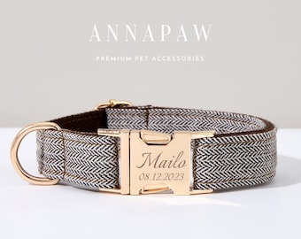 May include: A brown and white herringbone patterned dog collar with a gold metal buckle. The buckle is engraved with the name "Milo" and the date "08.12.2023".
