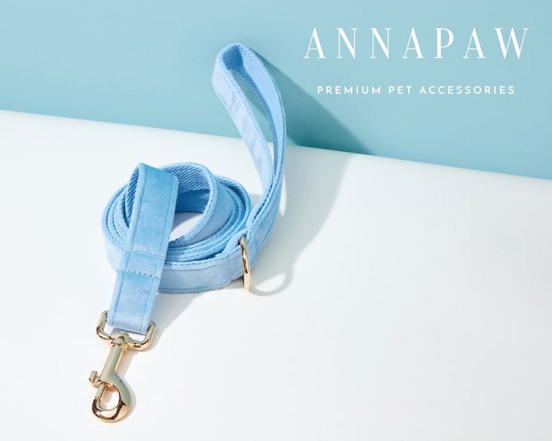 May include: A light blue velvet dog lead with a gold metal clasp and a gold ring. ANNAPAW PREMIUM PET ACCESSORIES.