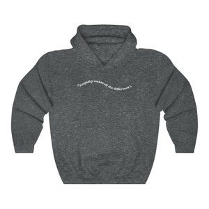 May include: A dark gray hooded sweatshirt with the text "Empathy makes all the difference" printed in white on the front.