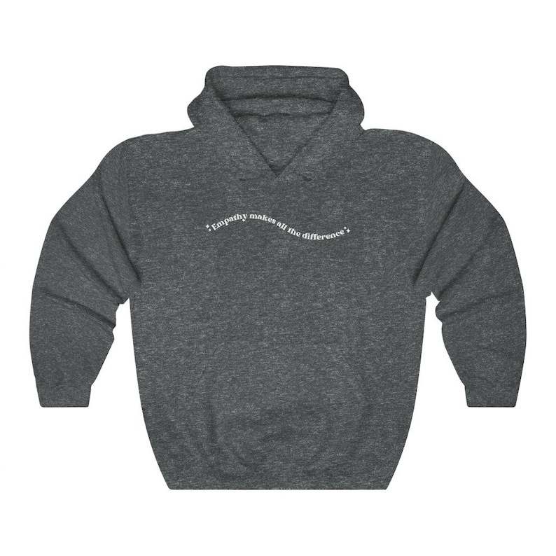 May include: A dark gray hooded sweatshirt with the text "Empathy makes all the difference" printed in white on the front.